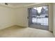 Condo bedroom with sliding glass door to balcony and carpet at 2575 S Syracuse Way # 108, Denver, CO 80231