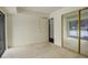 Condo bedroom with sliding mirrored closet doors and carpet at 2575 S Syracuse Way # 108, Denver, CO 80231