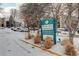 Hunter's Run Condominiums sign, snow covered entrance and parking lot at 2575 S Syracuse Way # 108, Denver, CO 80231
