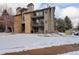 Exterior view of the building in a winter setting at 2575 S Syracuse Way # 108, Denver, CO 80231