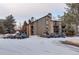 Exterior view of the building with snow on the ground at 2575 S Syracuse Way # 108, Denver, CO 80231