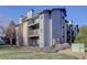 Three-story building with gray siding and balconies at 2575 S Syracuse Way # 108, Denver, CO 80231