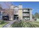 Attractive exterior of a two-story condo building with landscaping at 2575 S Syracuse Way # 108, Denver, CO 80231