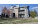 Front view of a three-story building with stone accents at 2575 S Syracuse Way # 108, Denver, CO 80231