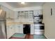 Galley kitchen, equipped with stainless steel appliances at 2575 S Syracuse Way # 108, Denver, CO 80231