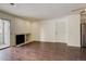 Bright living room with fireplace, wood floors, and access to patio at 2575 S Syracuse Way # 108, Denver, CO 80231