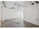 Unfinished basement with concrete floors, white walls and ceiling at 4326 Batavia Pl, Denver, CO 80220
