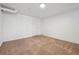 Finished basement with neutral carpet and white walls at 4326 Batavia Pl, Denver, CO 80220