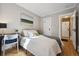 Serene bedroom with a comfortable bed, soft lighting, and ample closet space at 4326 Batavia Pl, Denver, CO 80220