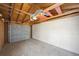 Empty garage with concrete floor and exposed ceiling at 4326 Batavia Pl, Denver, CO 80220