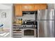 Well-equipped kitchen with stainless steel appliances and granite countertops at 4326 Batavia Pl, Denver, CO 80220