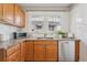 Kitchen featuring granite countertops, wooden cabinets, and stainless steel appliances at 4326 Batavia Pl, Denver, CO 80220