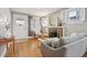 Comfortable living room featuring hardwood floors, a fireplace, and plenty of seating at 4326 Batavia Pl, Denver, CO 80220
