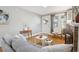 Bright living room featuring hardwood floors and neutral tones, offering a cozy and inviting atmosphere at 4326 Batavia Pl, Denver, CO 80220