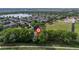 Stunning aerial view of property with lake and community amenities and a park nearby at 1440 E 128Th Ct, Thornton, CO 80241