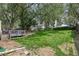 Large grass backyard featuring mature trees at 1440 E 128Th Ct, Thornton, CO 80241