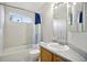 Second bathroom features tub, shower and single sink at 1440 E 128Th Ct, Thornton, CO 80241