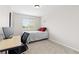 Bedroom with neutral walls, carpet, a window and desk with chair, perfect for studying at 1440 E 128Th Ct, Thornton, CO 80241