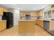 Well-equipped kitchen featuring stainless steel appliances and a functional center island at 1440 E 128Th Ct, Thornton, CO 80241