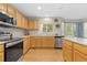 Functional kitchen featuring stainless steel appliances, ample counter space, and natural light at 1440 E 128Th Ct, Thornton, CO 80241