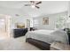 Bright main bedroom featuring vaulted ceilings, ceiling fan, and ensuite bathroom at 1440 E 128Th Ct, Thornton, CO 80241