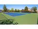 Community tennis courts featuring well-maintained blue courts surrounded by green fencing at 1440 E 128Th Ct, Thornton, CO 80241