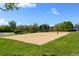 Outdoor sand volleyball court surrounded by a grassy area perfect for recreational activities at 1440 E 128Th Ct, Thornton, CO 80241