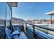 Cozy balcony with chairs overlooking city skyline views on a winter day at 2114 N Clay St, Denver, CO 80211