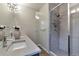 A modern bathroom with a glass shower, double vanity, and contemporary fixtures at 2114 N Clay St, Denver, CO 80211