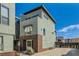 Modern townhome with a mix of brick and siding and ample parking at 2114 N Clay St, Denver, CO 80211