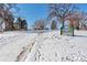 A view of a park in the winter with snowy ground and bare trees at 2114 N Clay St, Denver, CO 80211