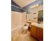 A bathroom featuring a bathtub, toilet, vanity, and medicine cabinet at 10064 Westside Cir, Littleton, CO 80125