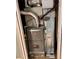 A home furnace, with visible controls and metal ductwork at 10064 Westside Cir, Littleton, CO 80125