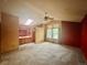 Spacious primary bedroom features vaulted ceilings, neutral carpet, and an ensuite bathroom at 10064 Westside Cir, Littleton, CO 80125