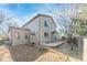 Exterior of home showing deck and yard with mature trees and recent landscaping at 2875 S Tower Way, Aurora, CO 80013