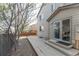 Exterior of home showing the wood deck and yard with mature shade tree at 2875 S Tower Way, Aurora, CO 80013