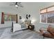Bright bedroom with two large windows, a ceiling fan, and modern stylish decor at 2875 S Tower Way, Aurora, CO 80013