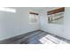 Spacious bedroom featuring wood-look floors and a window offering ample natural light at 2875 S Tower Way, Aurora, CO 80013