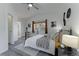 Spacious bedroom with large windows, ceiling fan, and modern decor, adjacent to bathroom at 2875 S Tower Way, Aurora, CO 80013