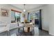 Cozy dining area with a round table, natural light, and a sliding glass door at 2875 S Tower Way, Aurora, CO 80013