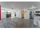 Bright living room featuring a decorative fireplace, modern flooring, and ample natural light at 2875 S Tower Way, Aurora, CO 80013