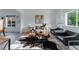 Stylish living room with modern furniture, wood floors, and natural light at 2875 S Tower Way, Aurora, CO 80013