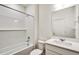 Clean bathroom with shower/tub combo and white vanity at 13547 Valentia St, Thornton, CO 80602