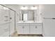 Bathroom with double vanity and a large shower at 13547 Valentia St, Thornton, CO 80602