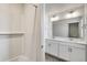 Double vanity bathroom with shower/tub combo at 13547 Valentia St, Thornton, CO 80602