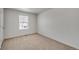 Bright bedroom with neutral carpeting at 13547 Valentia St, Thornton, CO 80602