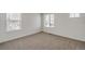 Spacious bedroom with two windows at 13547 Valentia St, Thornton, CO 80602