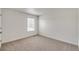 Simple bedroom with neutral wall and carpeting at 13547 Valentia St, Thornton, CO 80602