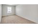 Spacious bedroom with large window and carpet at 13547 Valentia St, Thornton, CO 80602