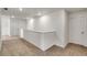 Upstairs hallway with carpet and access to bedrooms at 13547 Valentia St, Thornton, CO 80602